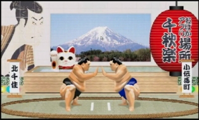 どんどん相撲の画面。デザイナの鹿倉さんいわく「写楽に富士山、ちょうちん、招き猫というデザインは、外国人に興味を持ってもらうため日本的なものを詰め込んだ」とのこと