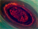 宇宙すごすぎ　赤いバラのような土星のハリケーン