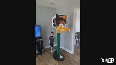 uKid Performs Cool Trick Shots By Putting Different Balls Through Mini Basketball Hoop - 1186085v