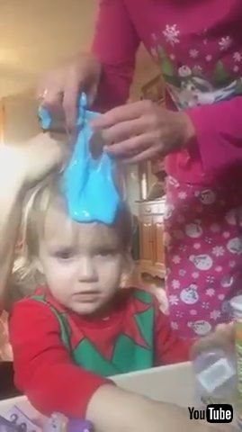 uParents Try to Remove Blue Slime Stuck in Kid's Hair - 1212521v