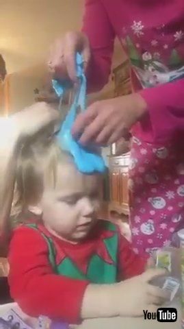 uParents Try to Remove Blue Slime Stuck in Kid's Hair - 1212521v