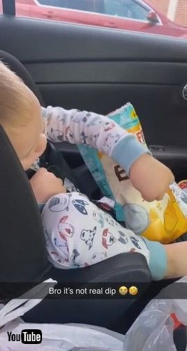 uToddler Tries to Eat Chips With Picture of Dip Printed on Packet - 1224216v
