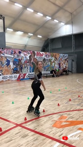 Girl Effortlessly Rollerblades Through Obstacle Track