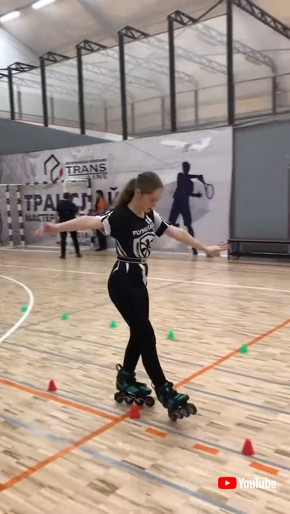 Girl Effortlessly Rollerblades Through Obstacle Track