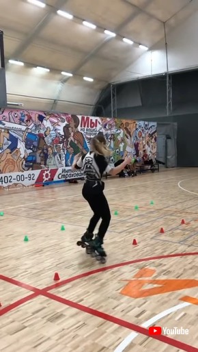 Girl Effortlessly Rollerblades Through Obstacle Track