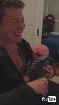 「Baby Laughs at Mom Putting Pacifier in Mouth - 985799」