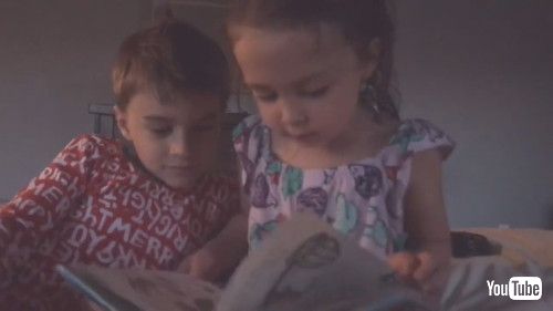 「Kid Helps Toddler Sister to Read Bedtime Story - 1256668」