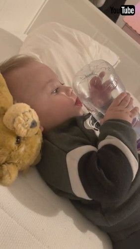 uBaby Tries Drinking Water From Bottom Of Bottle - 1279880v