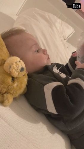 uBaby Tries Drinking Water From Bottom Of Bottle - 1279880v