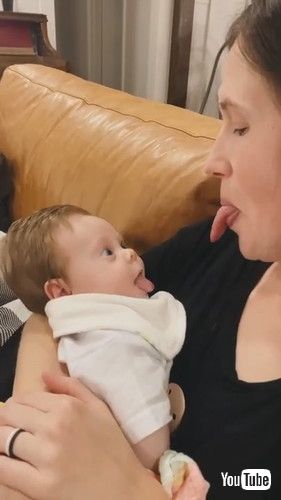 「Baby Copies Mom as She Sticks Her Tongue Out - 1281269」