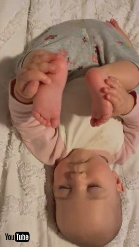 「Baby Falls Asleep Holding Her Feet || ViralHog」