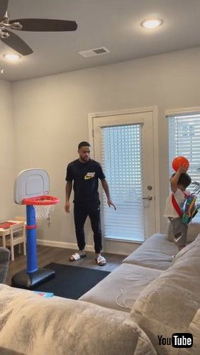 uToddler Repeatedly Shoots Mini Basketball Into Hoop - 1281365v_ācc