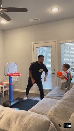 uToddler Repeatedly Shoots Mini Basketball Into Hoop - 1281365v