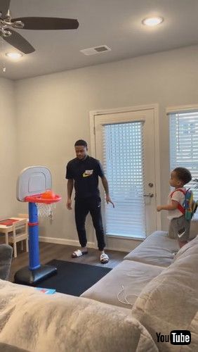 uToddler Repeatedly Shoots Mini Basketball Into Hoop - 1281365v