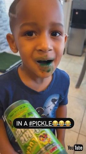 uSiblings Lie About Eating Pickles With Pickles All Over Their Hands and Mouth-1328612v