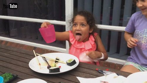 uLittle Girl Regrets Tasting Wasabi and Makes Hilarious Face - 1345217v
