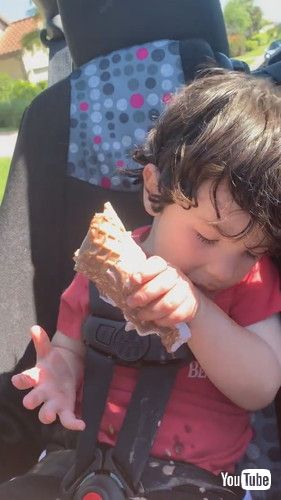 uLittle Boy Falls Asleep While Having Ice Cream - 1366873v