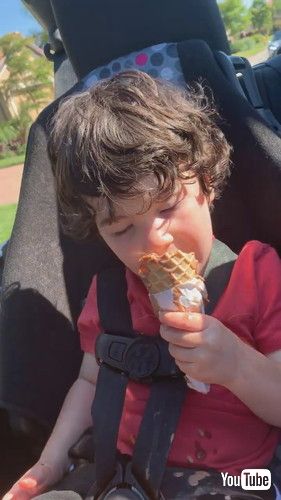 uLittle Boy Falls Asleep While Having Ice Cream - 1366873v