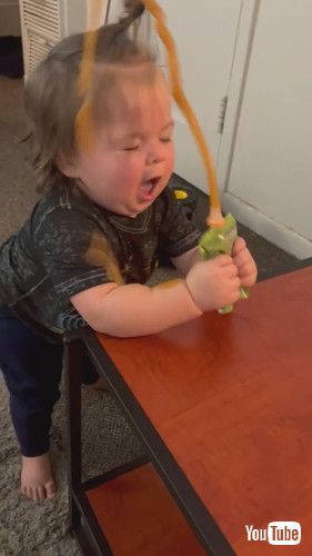 「Baby Spills Food All Over Himself After Squeezing it Out of Packet - 1375021」