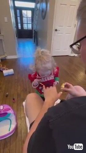 uAdorable Little Girl Applies Nail Polish to Her Father - 1395439-2v