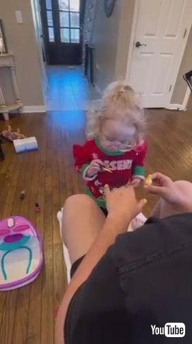 uAdorable Little Girl Applies Nail Polish to Her Father - 1395439-2v