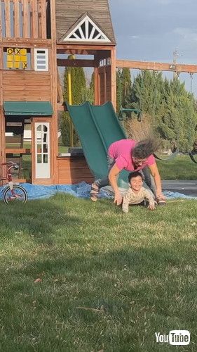 uGrandma Loses Balance and Falls Along With Grandson After Going Down Slide - 1417780v