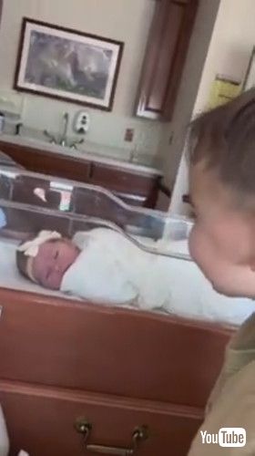 uToddler Brother Meets His Newborn Sister For First Time - 1412333v