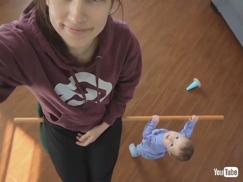 uToddler Uses Stick to Help Mom Spin on Revolving Chair - 1413227v