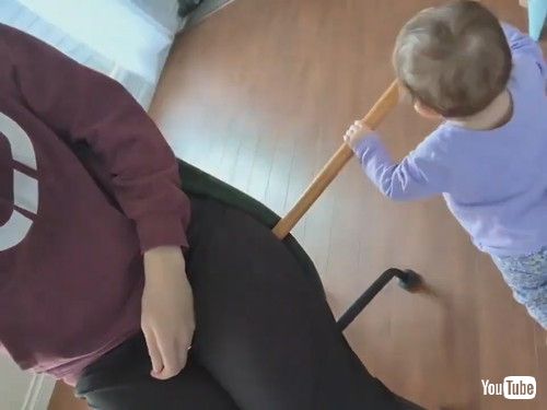 uToddler Uses Stick to Help Mom Spin on Revolving Chair - 1413227v