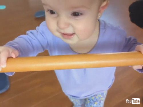 uToddler Uses Stick to Help Mom Spin on Revolving Chair - 1413227v